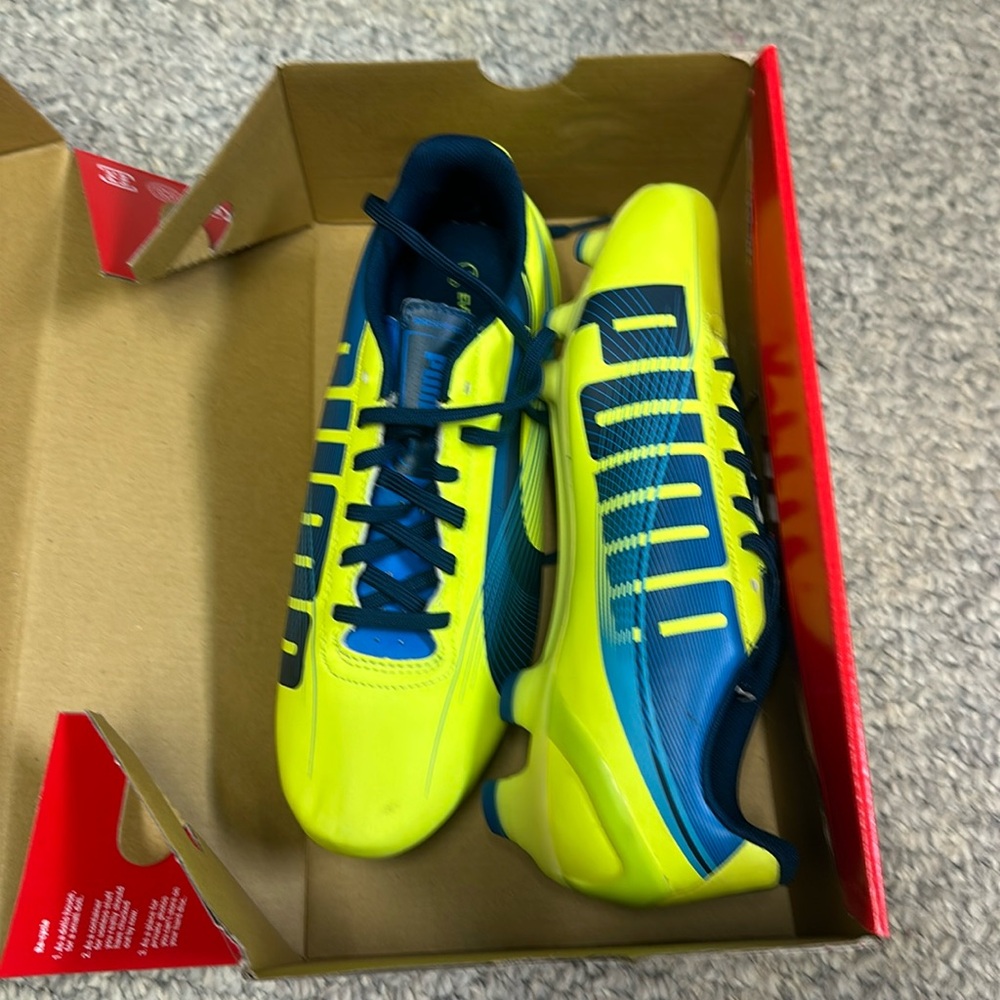 Yellow and blue Poseidon, women’s soccer cleats puma